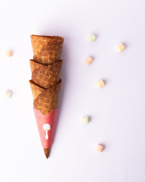 A cone with candy hearts and sprinkles