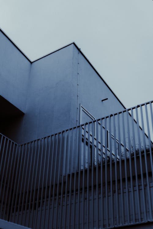 A building with a metal railing and stairs