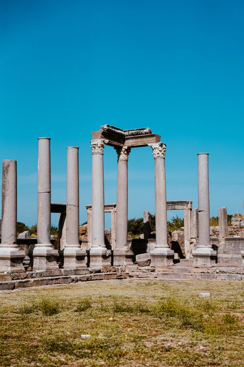 Free Explore the ancient colonnades of Perge, a historic site in Antalya, Turkey. Stock Photo