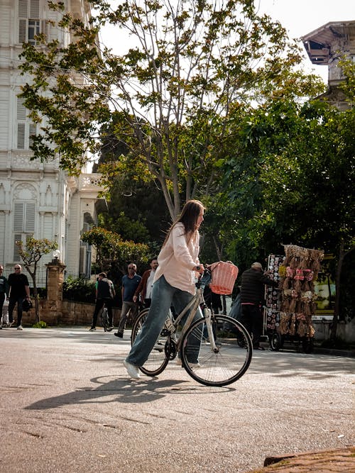 A woman riding a bike in a city