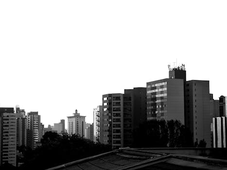 Monochrome view of urban cityscape with contemporary high-rise buildings.