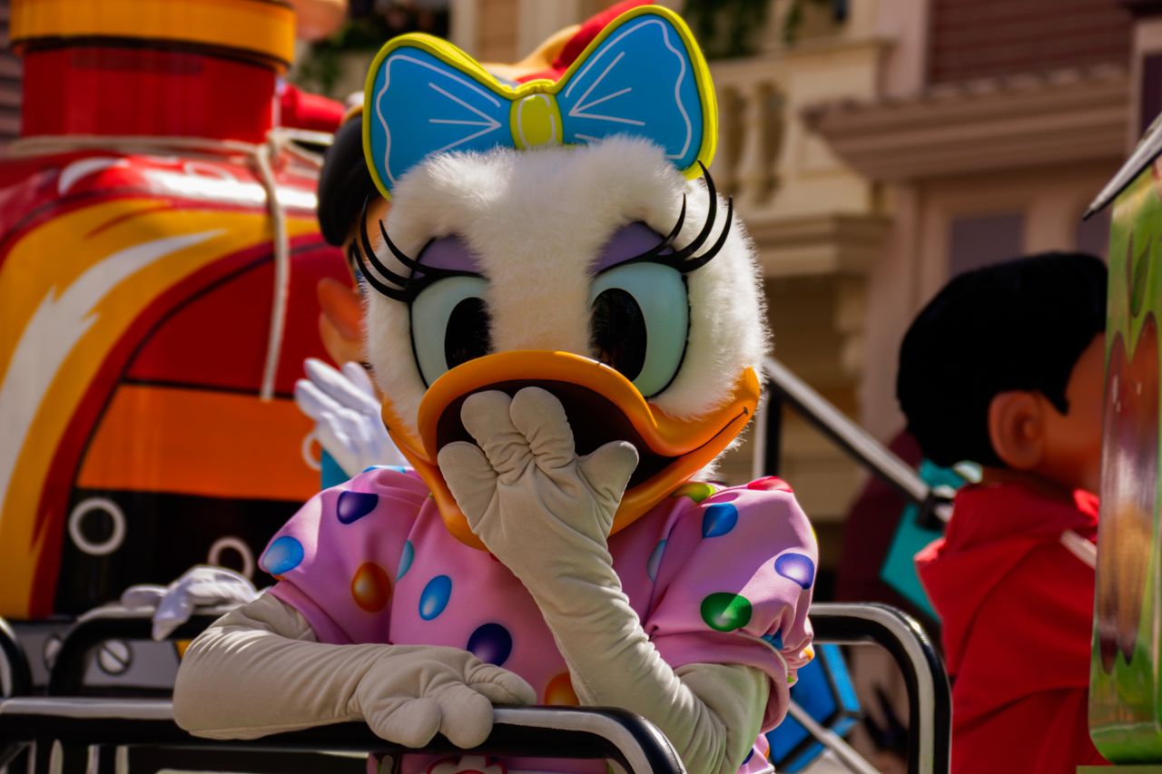 a vibrant character parade featuring a whimsical cartoon character in