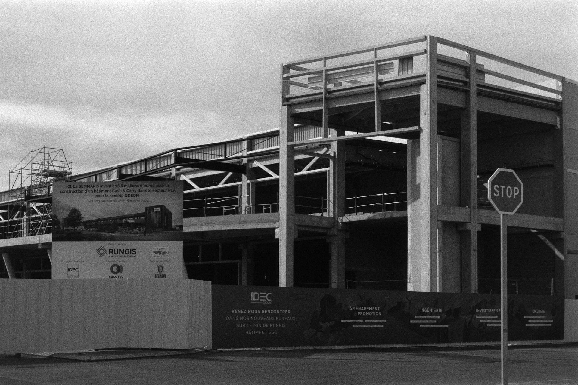 Black and White Photo of a Building under Construction