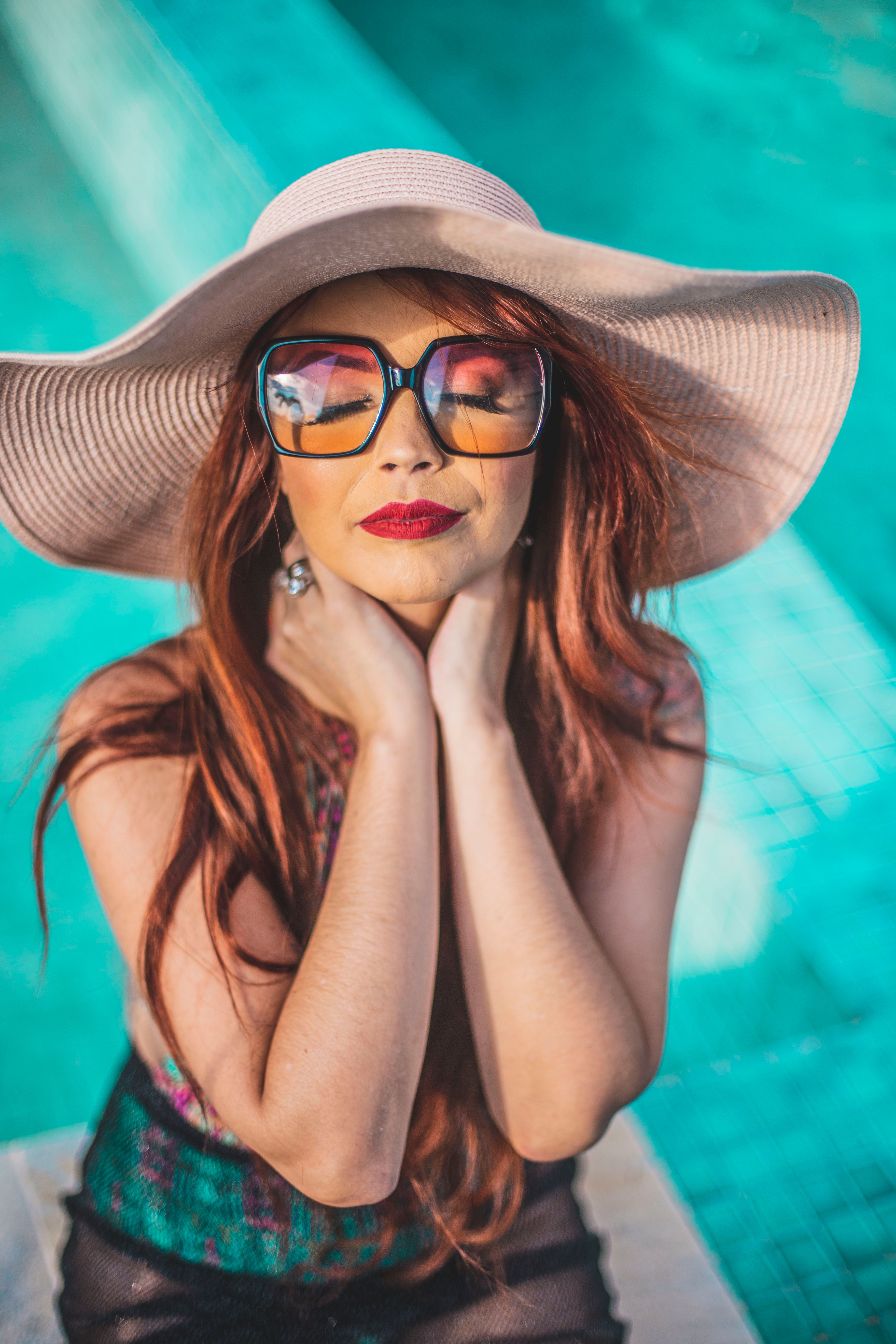 Woman Wearing Fascinator Hat and Yellow 