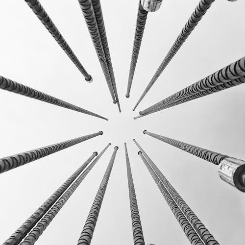 A black and white photo of a bunch of metal poles