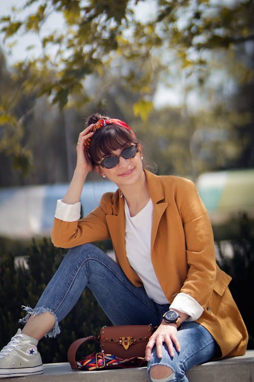 Woman Wearing Blue Coat and Blue Denim Jeans