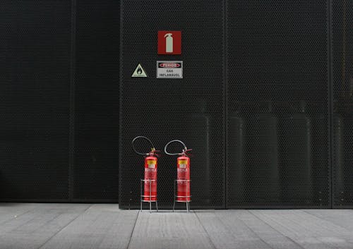 Free Pair of Red Fire Extinguisher Tanks  Stock Photo