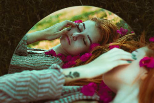 Woman Lying in Brown Grass Mirror Edited Photo