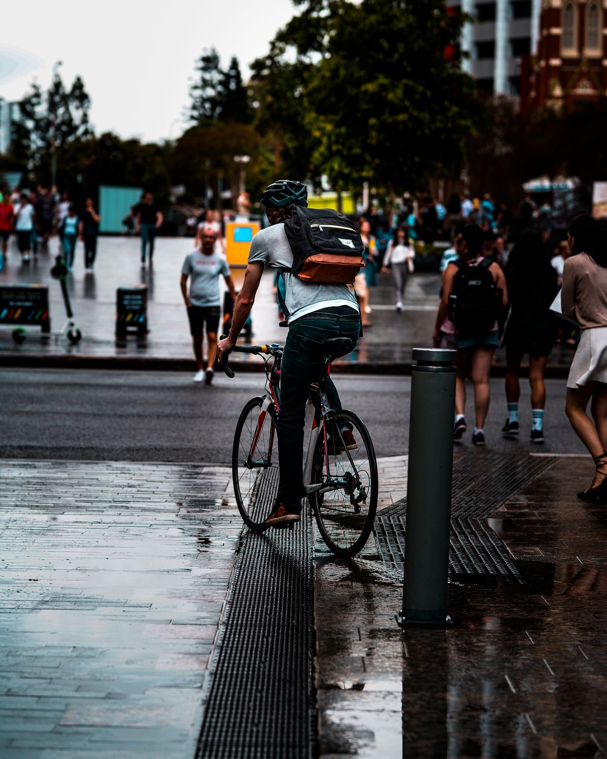 Cyclist traveling through a busy urban street during an everyday ride