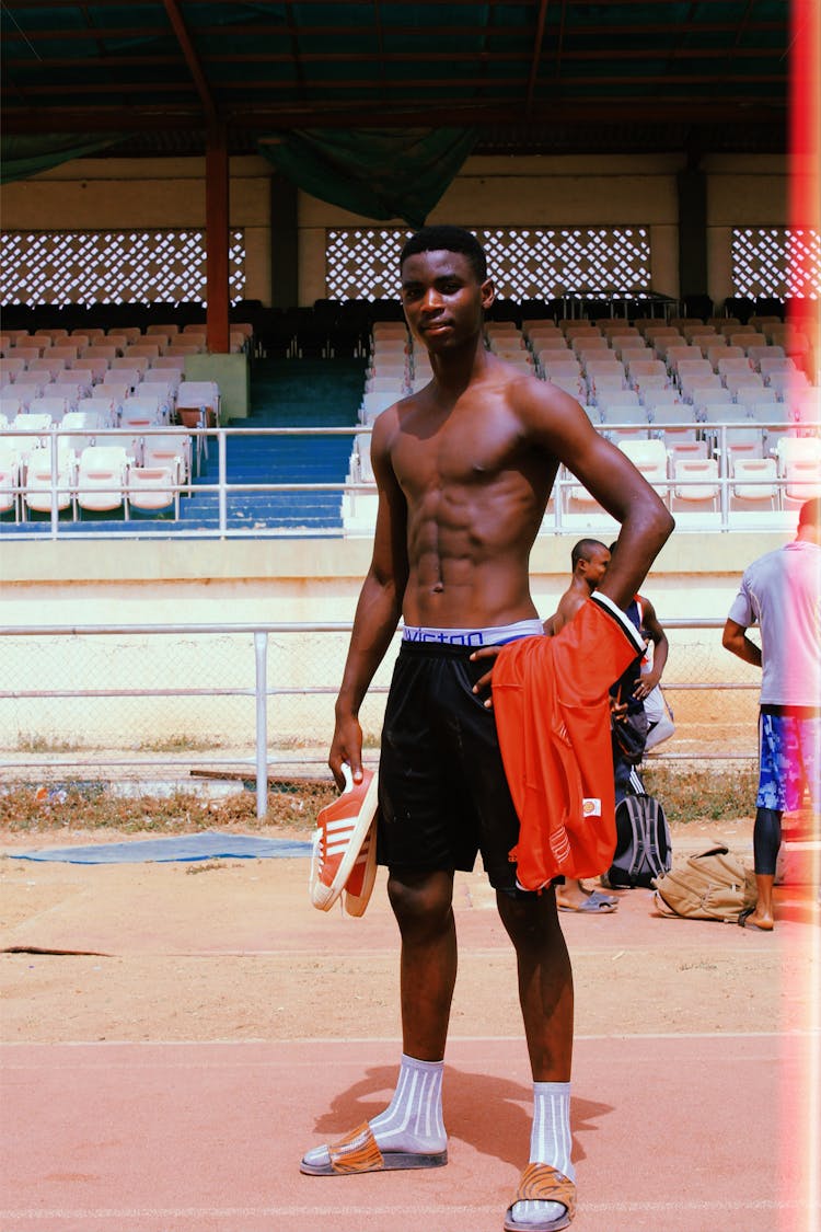 Shirtless Man Posing After A Game