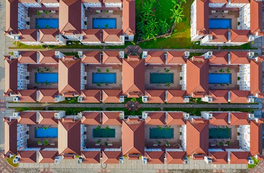 Aerial view of a housing complex with pools in Tangerang, Banten, Indonesia.