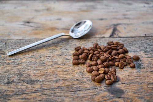 Free Coffee Beans Beside Tea Spoon Stock Photo