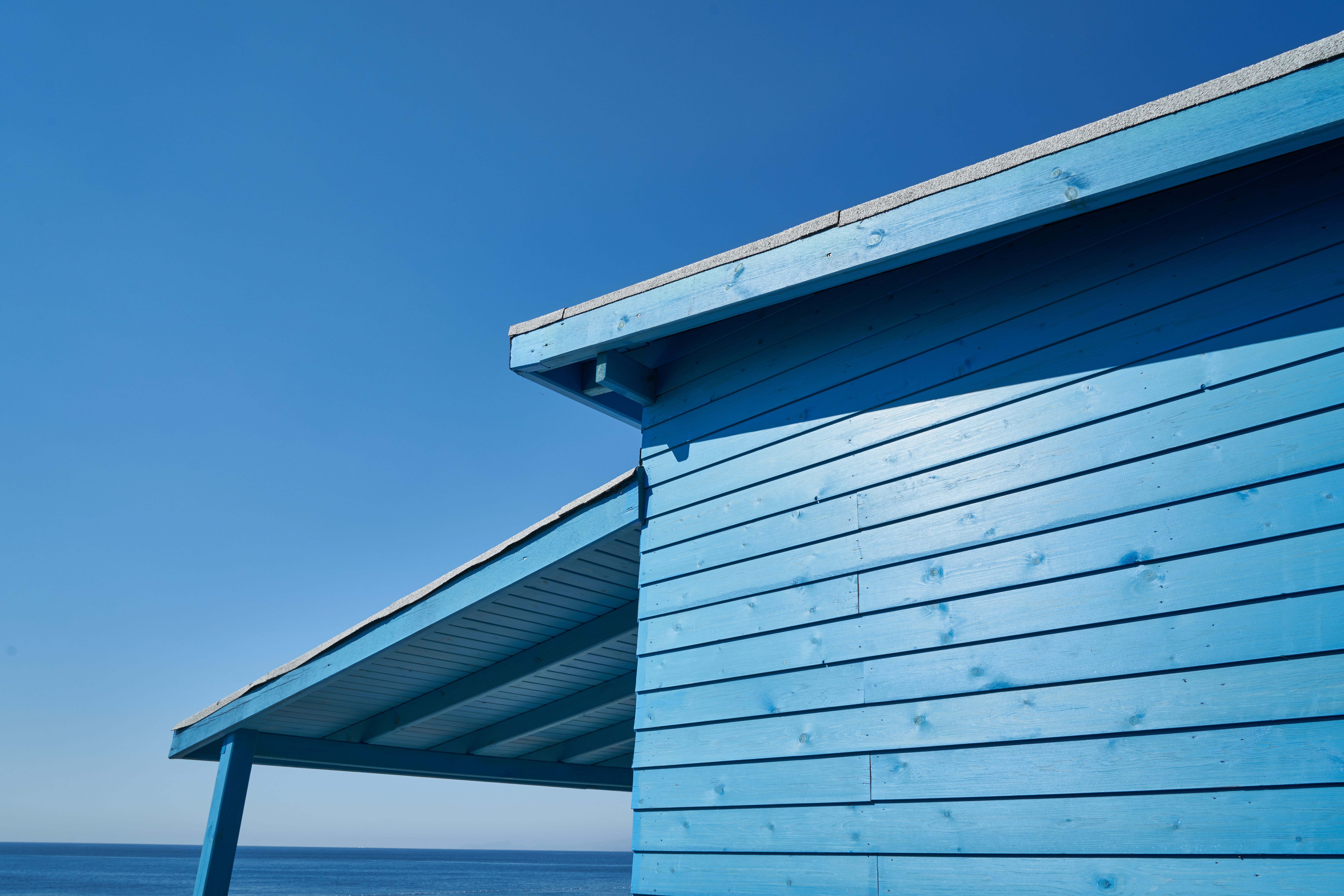 Blue Wooden House Under Blue Sky · Free Stock Photo