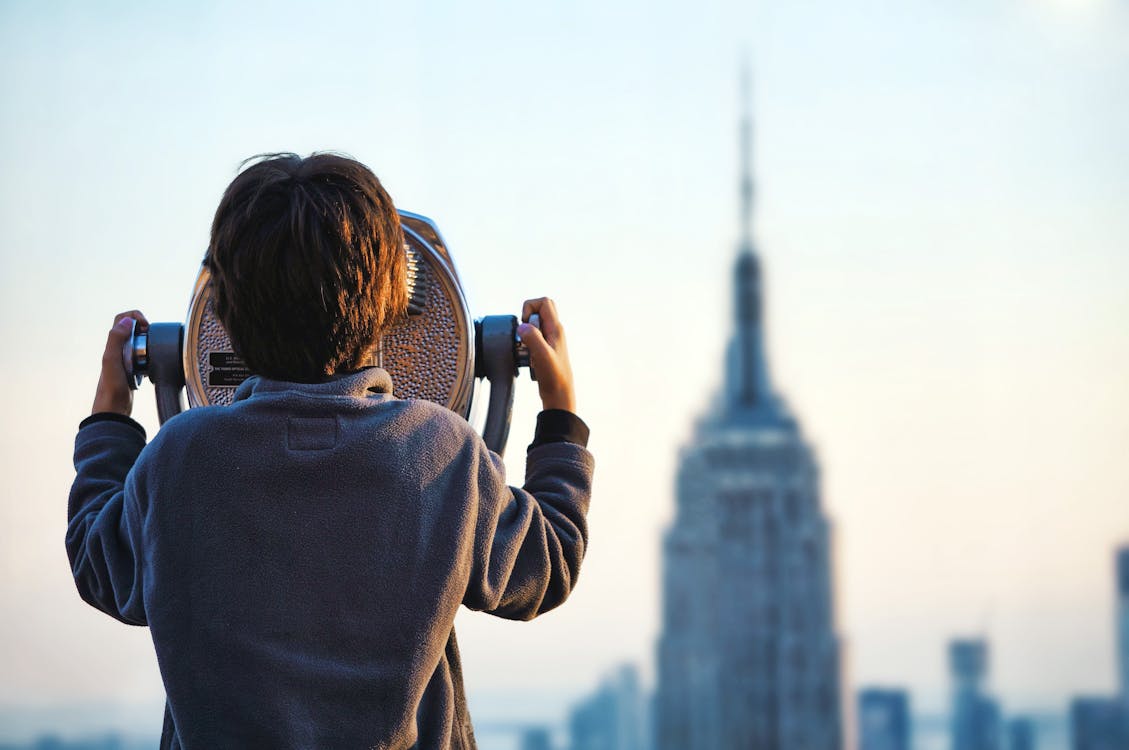 Free Boy Looking At The Empire State Building Stock Photo