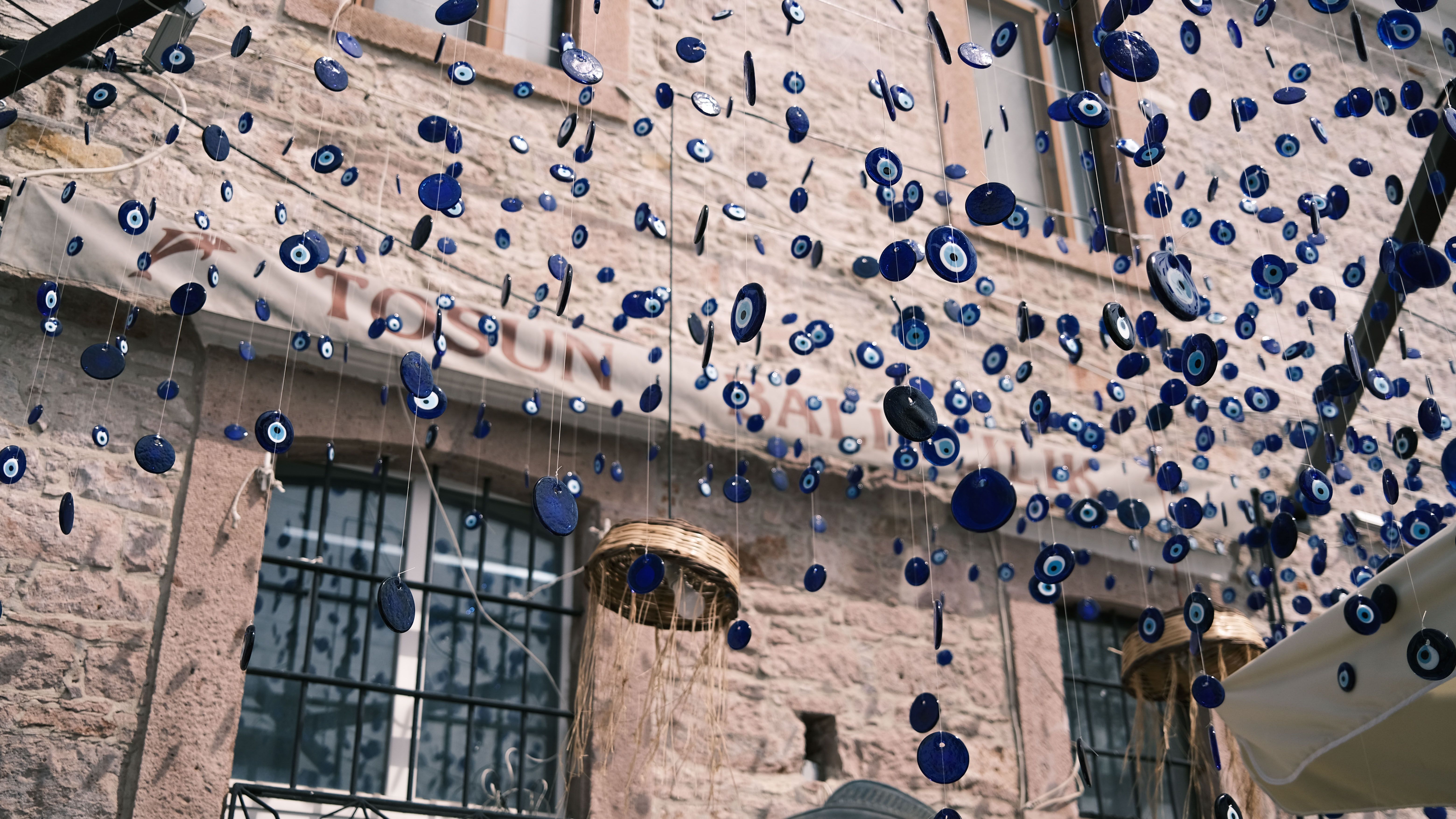 Nazar Pendants Hanging near Building Wall · Free Stock Photo