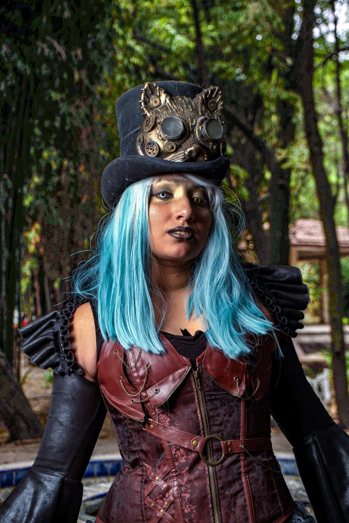 Blue-haired model in an elaborate steampunk costume