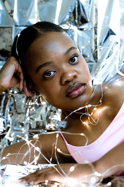 A young woman with silver tinsel on her head