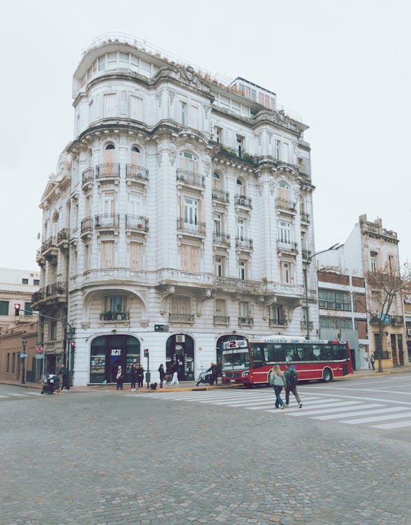 A bus is parked in front of a building