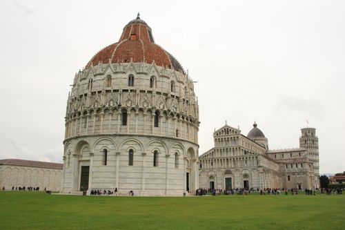 Iconic Pisa Baptistery and Cathedral with tourists, ideal for travel or architecture themes.
