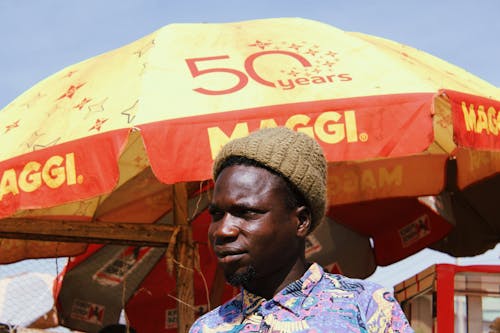 Photo of Man Wearing Brown Bonnet