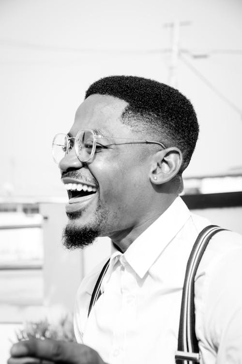 Laughing Man Wearing Collared Shirt and Suspenders