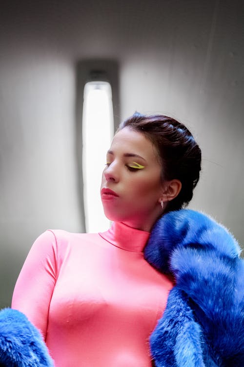 Woman Wearing Pink Turtleneck Top And Blue Fur Coat