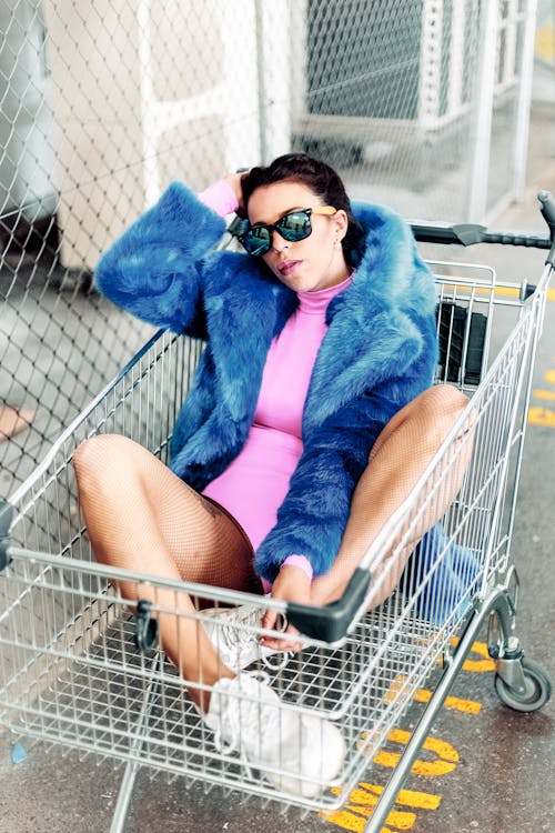 Woman Wearing Sunglasses On Shopping Cart