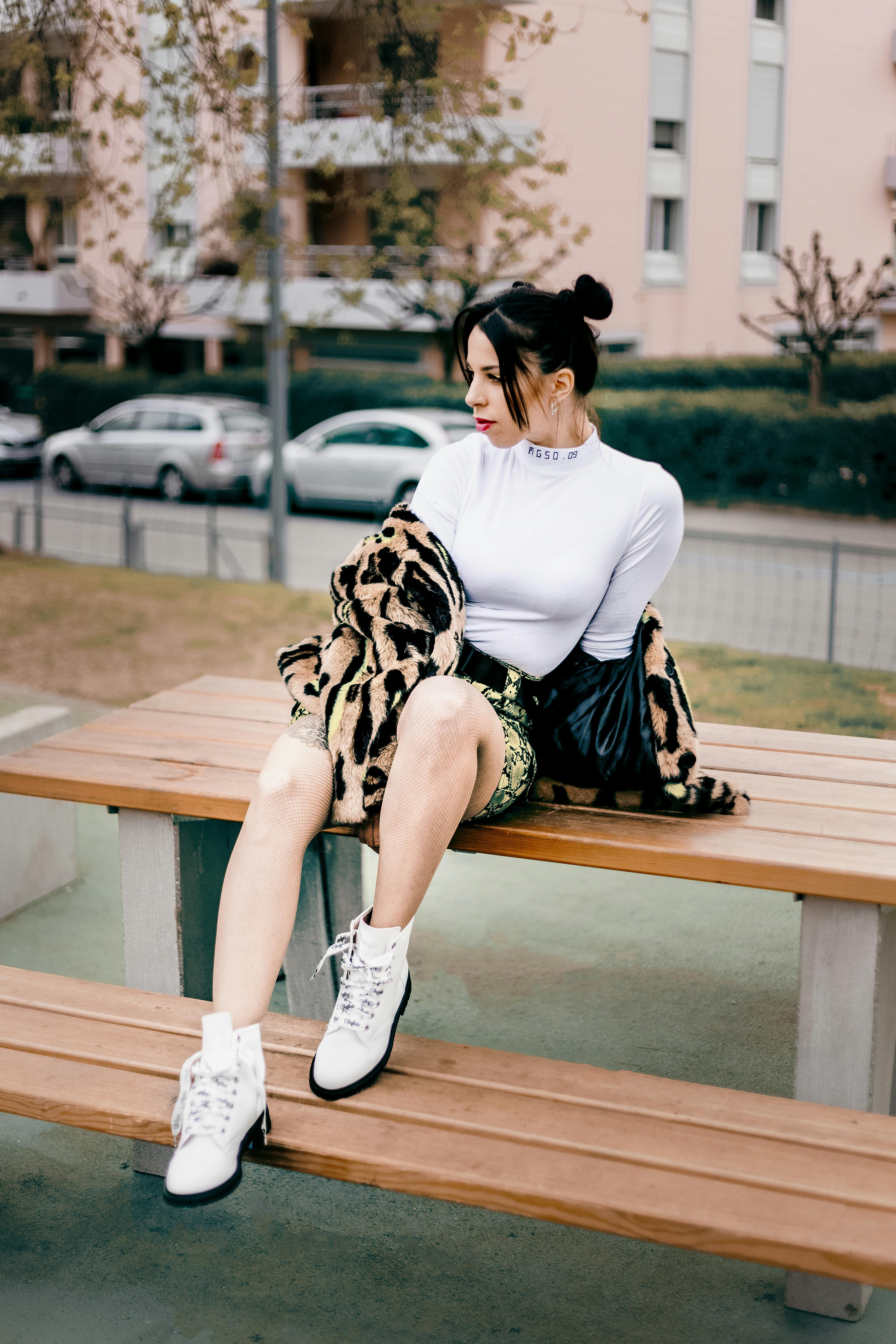 Woman Sitting on Picnic Table · Free Stock Photo