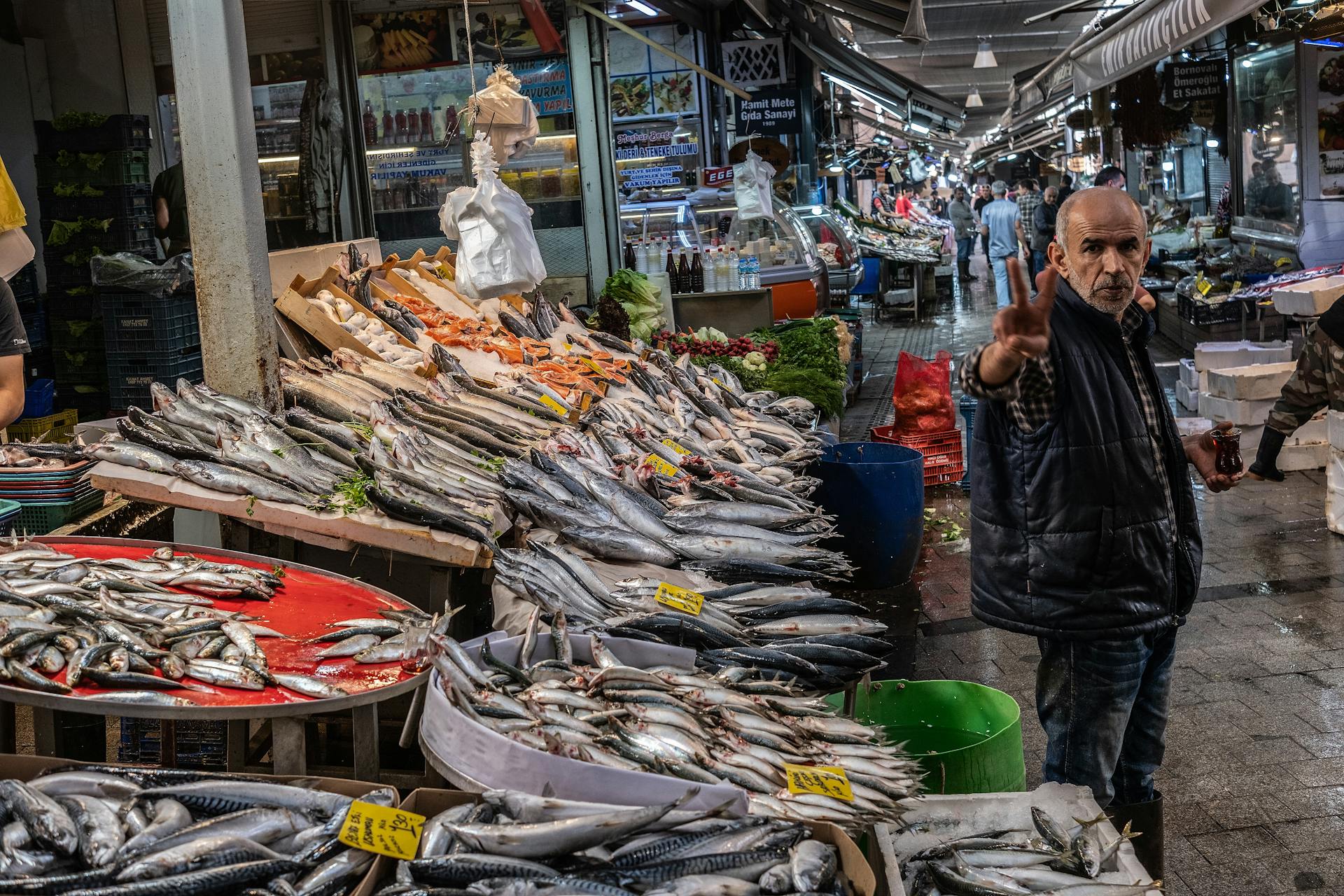 Fishmonger Standing at Bazaar in Turkey