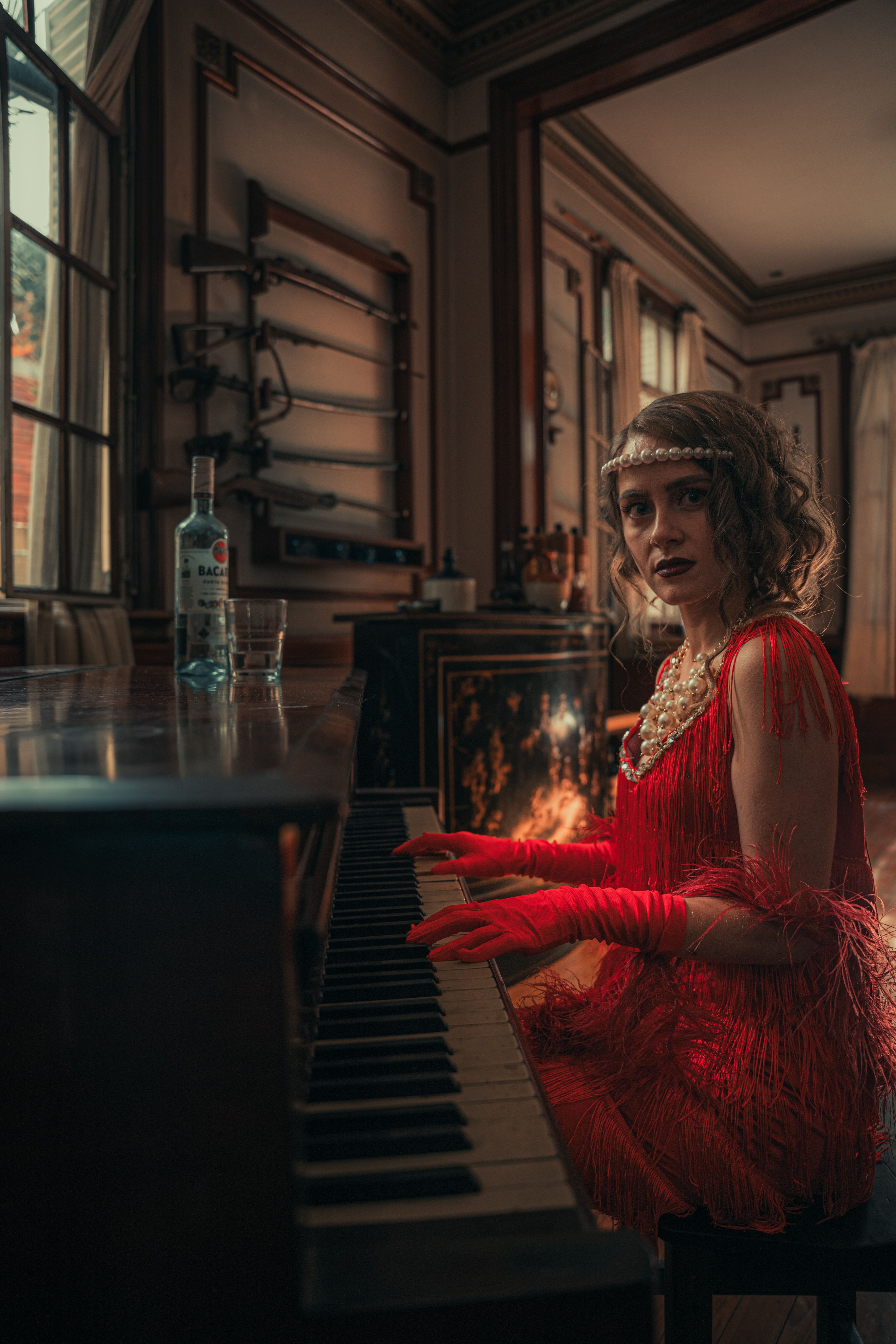 A woman in a red dress playing the piano · Free Stock Photo