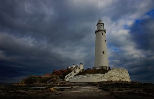 Free A dramatic view of St. Mary's Lighthouse against a backdrop of storm clouds in Whitley Bay, UK. Stock Photo
