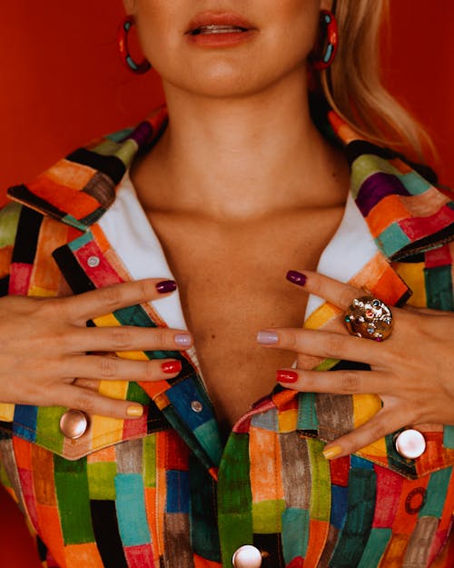 A woman with colorful clothes and jewelry