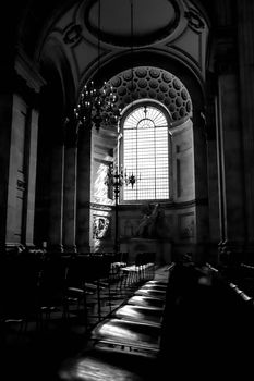 Dramatic black and white interior shot of a historic church in London, showcasing classic architecture.
