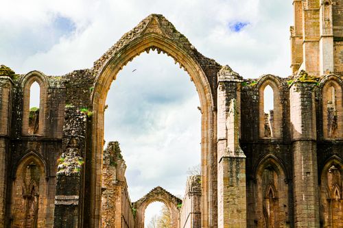 Free Explore the majestic ruins of an ancient Gothic church, showcasing architectural beauty. Stock Photo