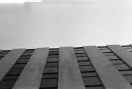 Black and white photograph of a building with a sky