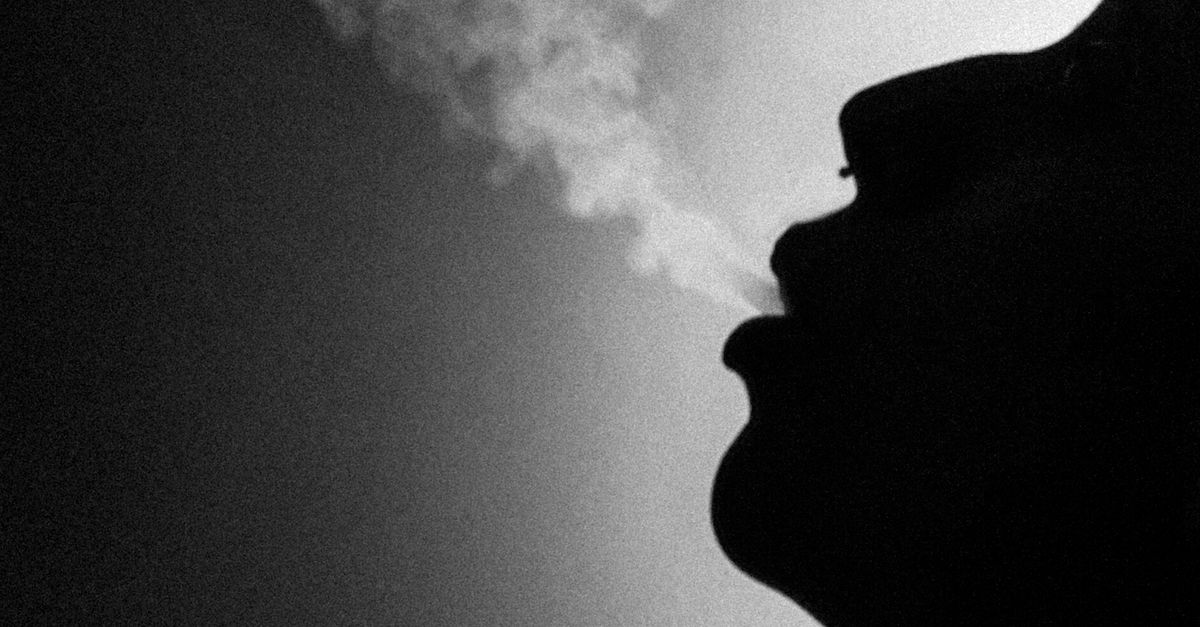 shadow smoking a cigarette of man cigarette, exhaling smoke on tiny man, harmful habit Stock Photo Free Smoke and Shadow Image