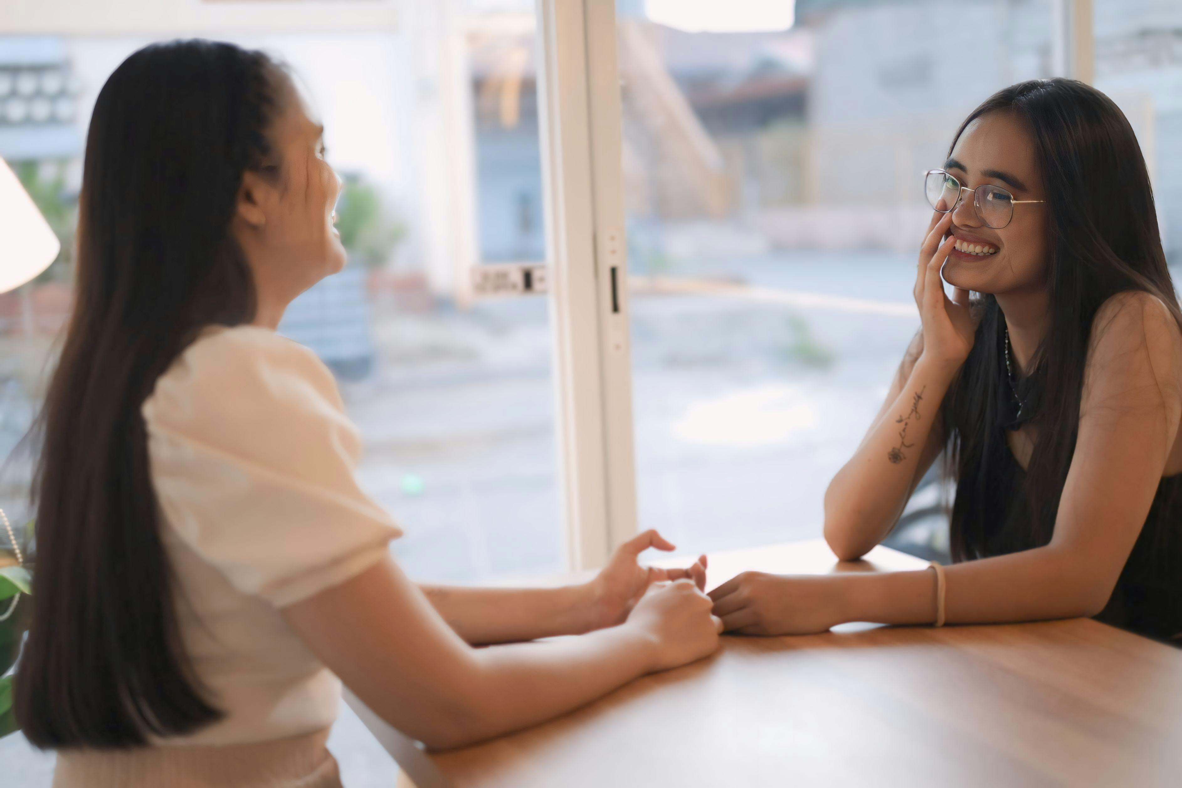 women talking at a table