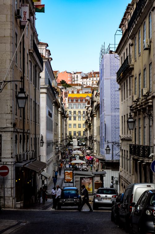 Free Explore the vibrant city streets of Lisbon with historic architecture and bustling urban life. Stock Photo