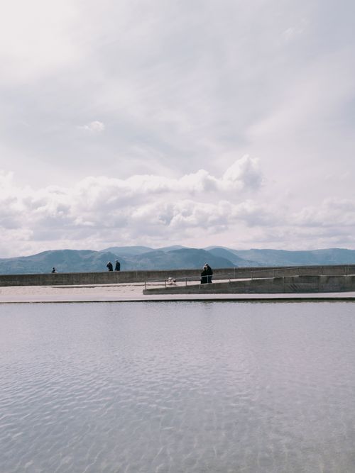 Free Tranquil scene at Llandudno, Wales with mountains and sea in view. Stock Photo
