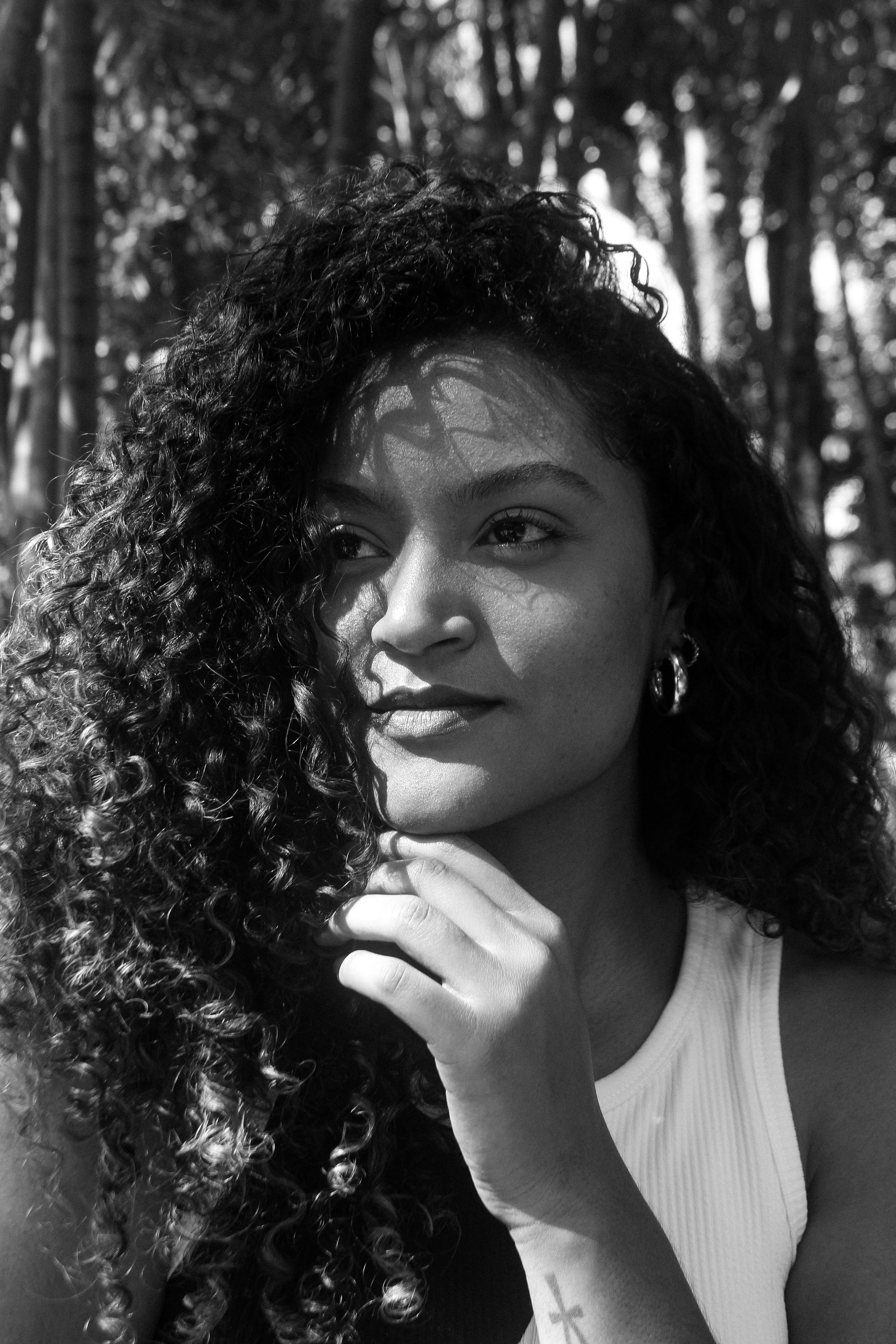 Black and White Portrait of a Young Woman with Curly Hair · Free Stock ...