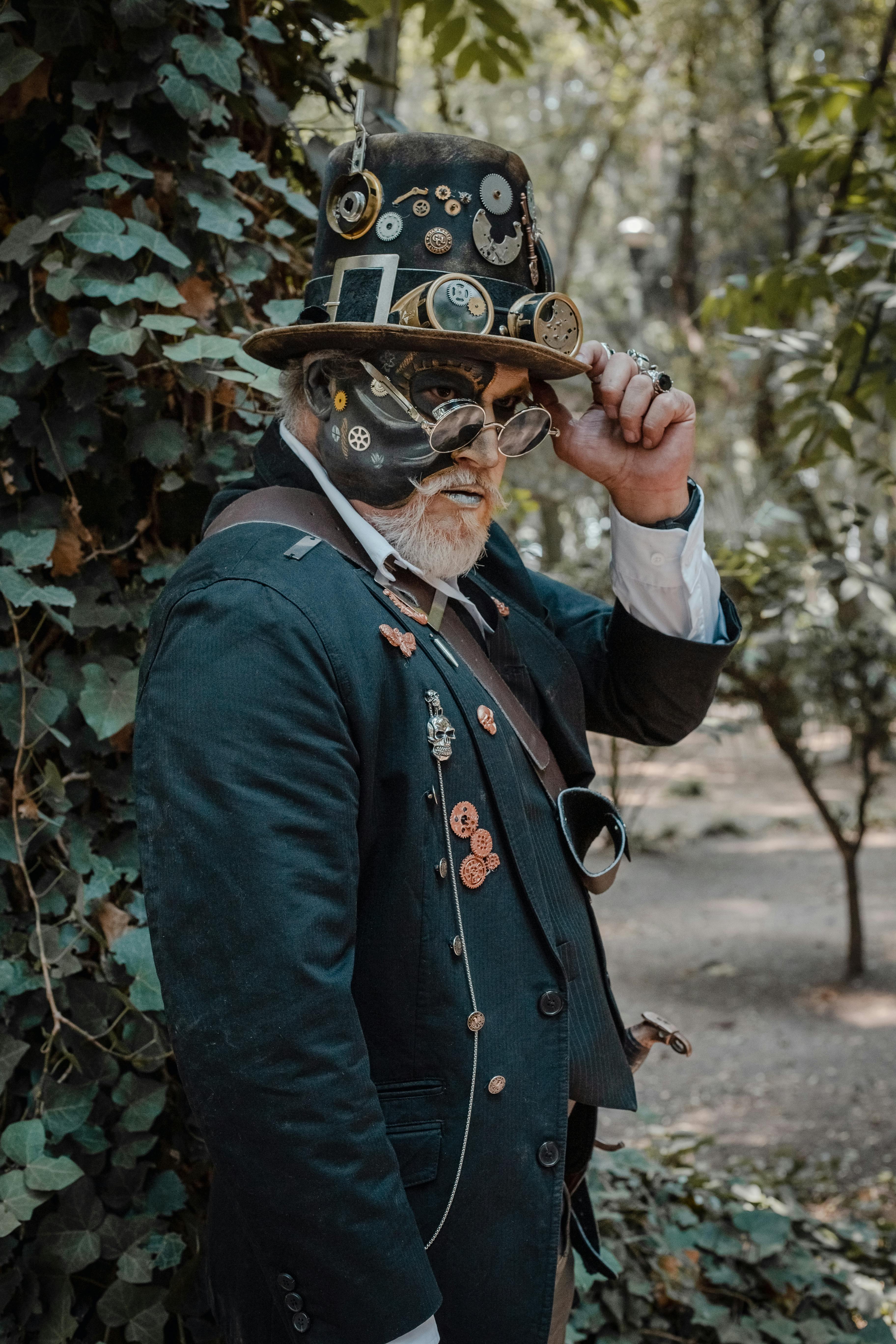 A well-dressed man in steampunk attire poses outdoors, showcasing intricate fashion elements.