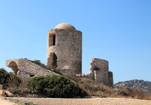 Stone ruins of an ancient castle under a clear blue sky in Corsica, France., free online jigsaw puzzle on JigsawPuzzlesFreeOnline.org