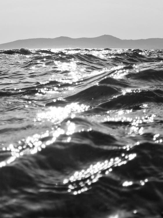 Black and white photo of waves on the ocean