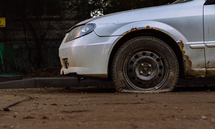 Car with a flat front tire