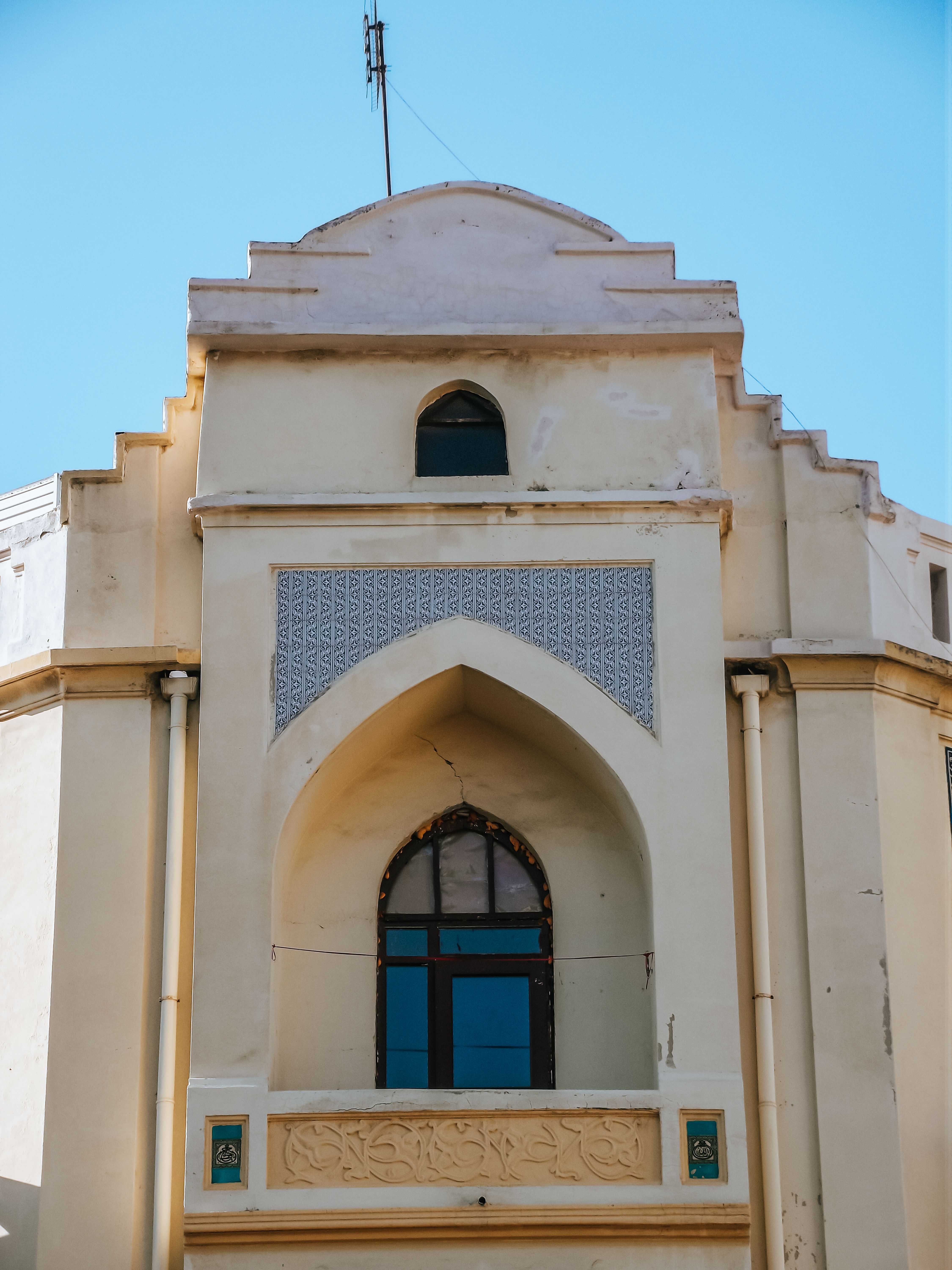 Facade of an Old Church Building under a Clear, Blue Sky · Free Stock Photo