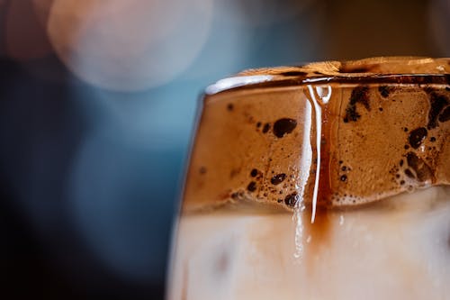 A close up of a glass of iced coffee