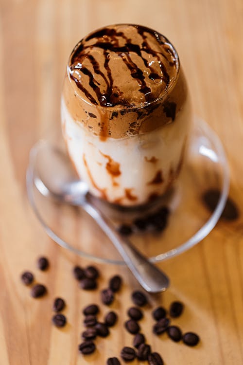 A chocolate milkshake with coffee beans on top