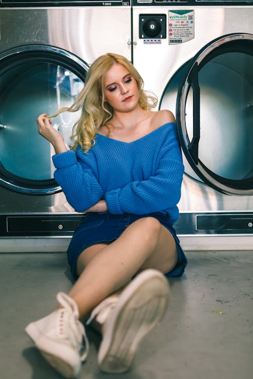 Woman Sitting Beside Front-load Washer