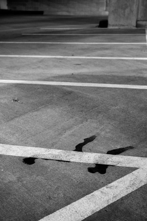 A black and white photo of a parking lot
