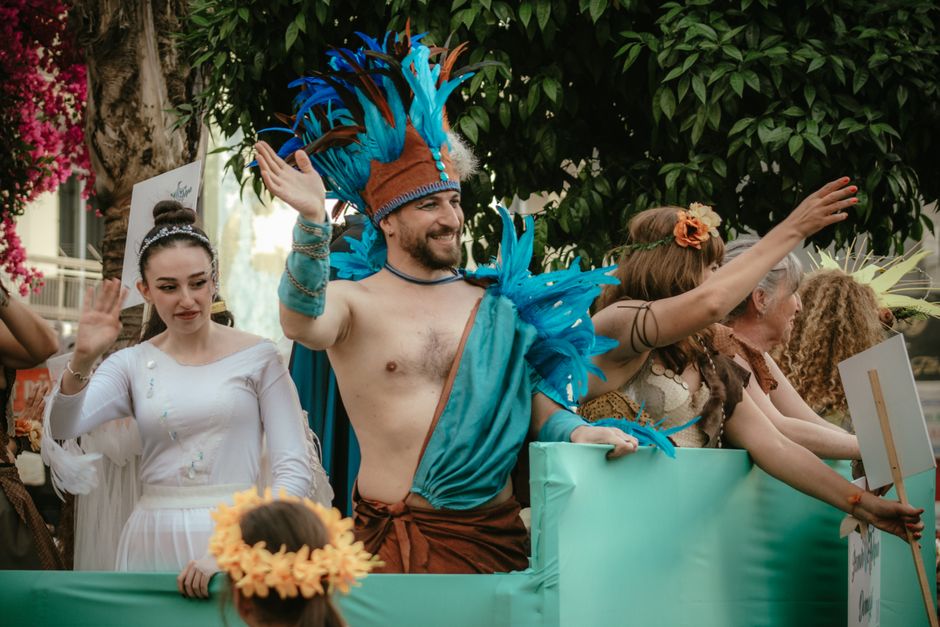 Colorful floats and costumed participants at the Malta Carnival parade in Valletta.